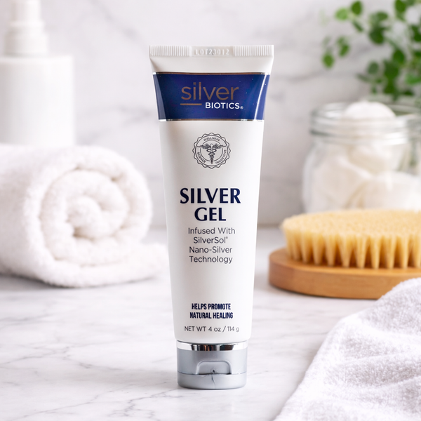 Tube of Silver Biotics silver gel on a bathroom counter with towels and a scrubber in the background.