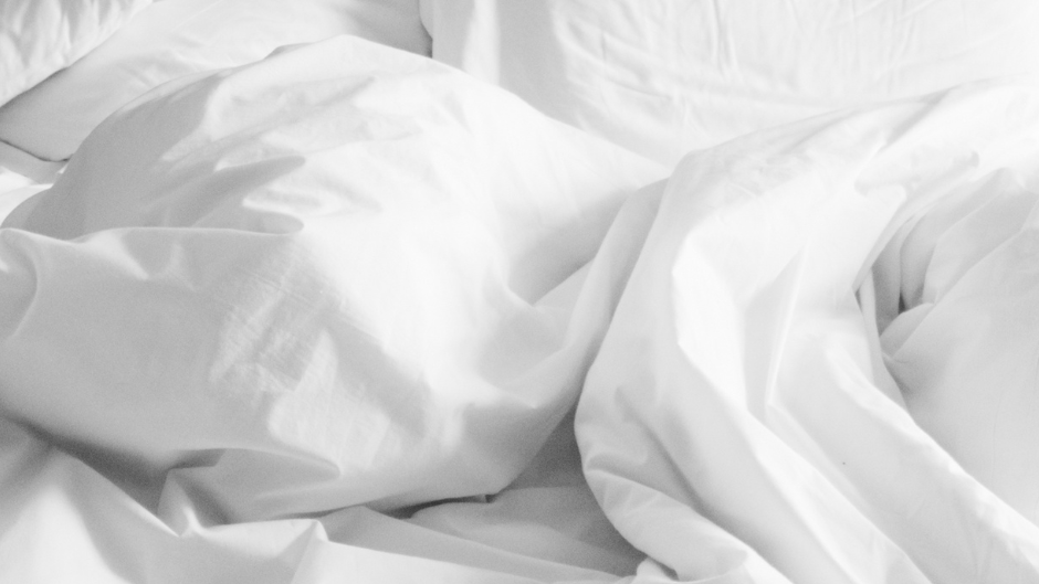 Close-up of white bedding with a soft texture