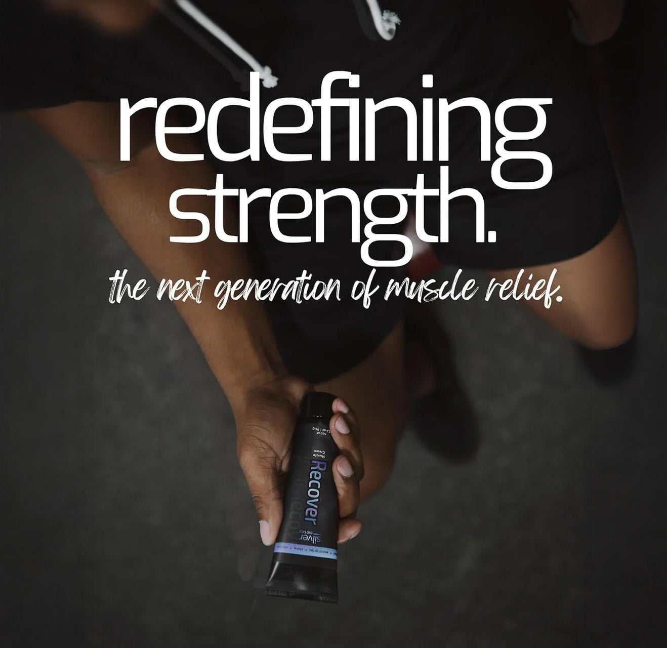 Person holding a tube of 'Heavenly Recovery' with text 'redefining strength. the next generation of muscle relief.'